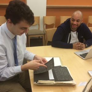 Temple University students Matt Cahill and David Polanco compare findings in the Special Collections seminar room, November 2014.